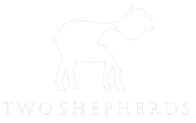 Two Shepherds Scrolled light version of the logo (Link to homepage)